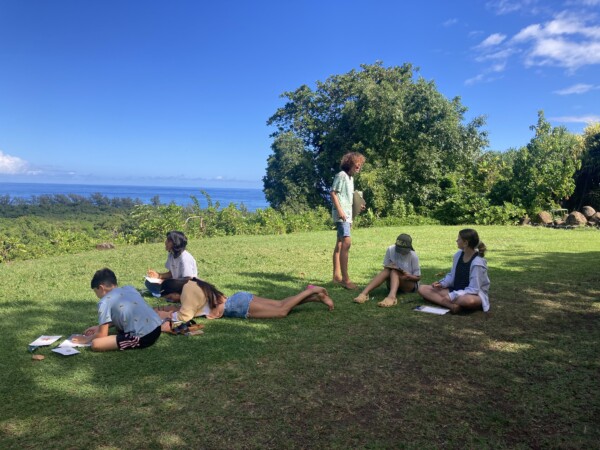 Students drawing outside
